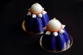 Two blue blueberry mousse desserts with white chocolate and meringues Royalty Free Stock Photo