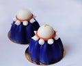 Two blue blueberry mousse desserts with white chocolate and meringues Royalty Free Stock Photo