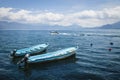 Two blue boats on lake Atitlan with view on volcanic mountians in Santa Cruz la Laguna, Guatemala Royalty Free Stock Photo