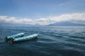 Two blue boats on lake Atitlan with view on volcanoe in Santa Cruz la Laguna, Guatemala Royalty Free Stock Photo