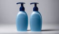 Two blue bottles of lotion on a white background Royalty Free Stock Photo