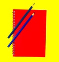 Two blue color wood pencil crayons placed on top of a red color note paper diary Royalty Free Stock Photo