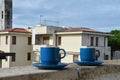 Two blue cups of coffee with panoramic view of a city in background. on the balcony against the backdrop of the old Royalty Free Stock Photo