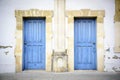 Two blue doors in a southern style building Royalty Free Stock Photo