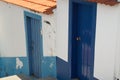 Two blue doors on white wall Royalty Free Stock Photo