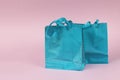 Two blue gift bags on a pink background Royalty Free Stock Photo