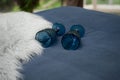 Two blue glasses lie on the bed Royalty Free Stock Photo