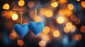Two blue hearts hanging from a string Royalty Free Stock Photo