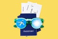 Two blue passports, boarding pass, flight tickets, sunglasses, airplane, sun, blue sky, summer holidays, vacation, travel, tourism Royalty Free Stock Photo