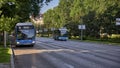 Two blue public buses on a street in Madrid closed to traffic Royalty Free Stock Photo