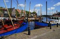 Two blue ships in the historical harbour fo Spakenburg