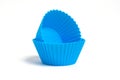 Two blue silicone molds for baking a cupcake on a white background Royalty Free Stock Photo