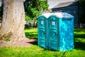 Two blue - white portable toilet cabins at outside event UK Royalty Free Stock Photo