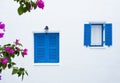 Two blue windows on white wall building Royalty Free Stock Photo