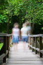 Two blurry girls walking