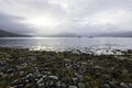 Two boats berthed on Loch Hourn water on Isle of Skye in an early morning