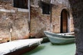 Two boats in the narrow channel of water a milky green. Royalty Free Stock Photo