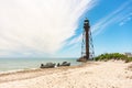 Two boats near the old rusty abandoned lighthouse on the Black Sea coast on Dzharylhach island Royalty Free Stock Photo