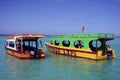 Two Boats at Pigeon Point Beach in Tobago Carribean Island Royalty Free Stock Photo