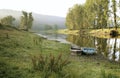 Two boats on the shore of small river in summer Royalty Free Stock Photo