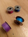 Four bobbins are placed on the floor Royalty Free Stock Photo