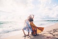 Boho girls walking on the beach