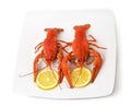 Two boiled crayfish with slices of lemon Royalty Free Stock Photo