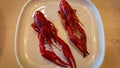 Two boiled crayfish on a white plate Royalty Free Stock Photo