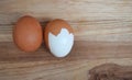 two boiled eggs with part of the egg shell peeled off Royalty Free Stock Photo