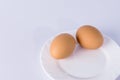 Two boiled eggs on a white plate. Royalty Free Stock Photo