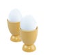 Two boiled eggs in yellow egg cups Royalty Free Stock Photo