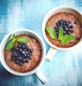 Two boils with Chia seed pudding with berries and carob Royalty Free Stock Photo