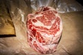 Two bone standing rib beef roast raw on butcher paper tied with string Royalty Free Stock Photo