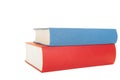 Two books one red and one blue lying isolated on a white background Royalty Free Stock Photo