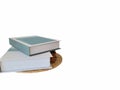 Two books stacked on top of each other and on a isolate white background Royalty Free Stock Photo