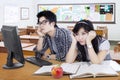 Two bored student studying in the class Royalty Free Stock Photo