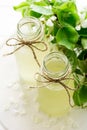 Two bottles of apple cider decorated pear blossom. Selective focus