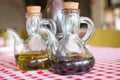 two bottles of balsamic vinegar and olive oil on a table Royalty Free Stock Photo