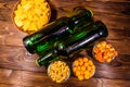 Two bottles of beer and different snacks on wooden table. Top view Royalty Free Stock Photo