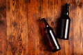 Two bottles of beer lie on an open table with empty space Royalty Free Stock Photo
