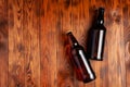 Two bottles of beer lie on an open table with empty space Royalty Free Stock Photo