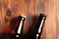 Two bottles of beer lie on an open table with empty space Royalty Free Stock Photo