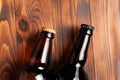Two bottles of beer lie on an open table with empty space Royalty Free Stock Photo