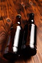 Two bottles of beer lie on an open table with empty space Royalty Free Stock Photo