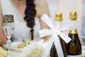 Two bottles of champagne are tied with ribbon. Russian wedding traditions Royalty Free Stock Photo