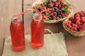 Two bottles of cold stewed fruit from assorted berries. Royalty Free Stock Photo