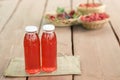 Two bottles of cold stewed fruit from assorted berries. Royalty Free Stock Photo