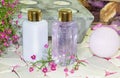 Two bottles of floral perfume