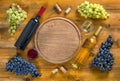 Two bottles and glasses with wine, grapes, corks and a corkscrew Royalty Free Stock Photo