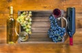 Two bottles with glasses of wine and grapes on wooden backgroun Royalty Free Stock Photo